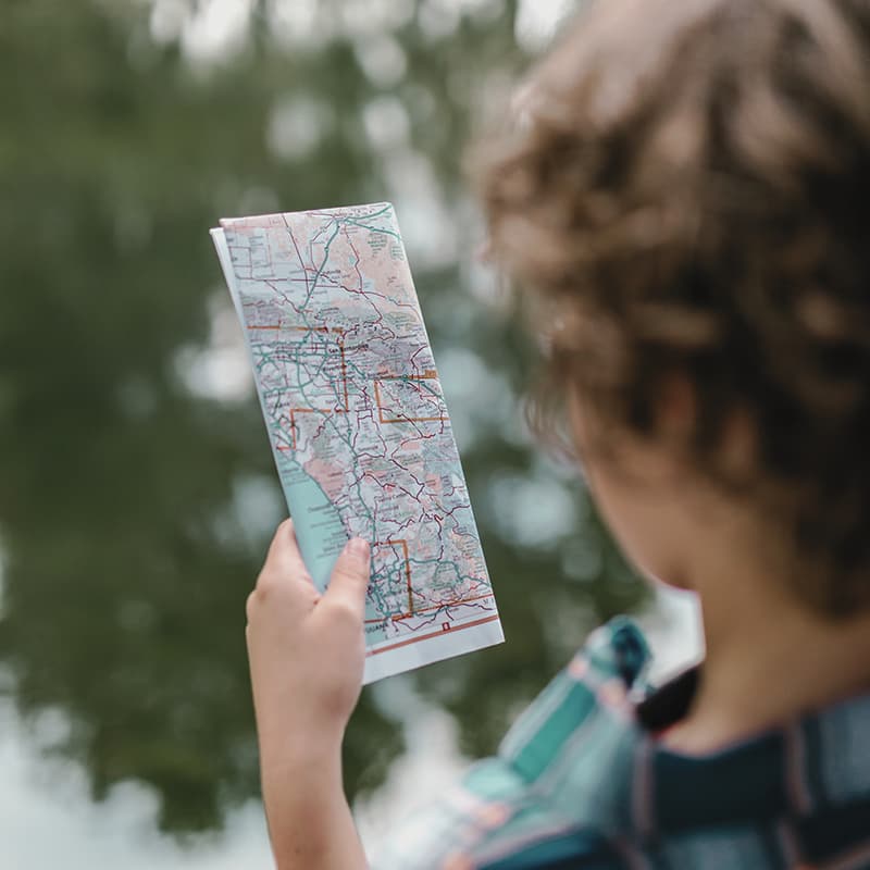 Child looking at a map